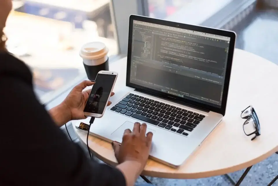 mobile phone connected to laptop
