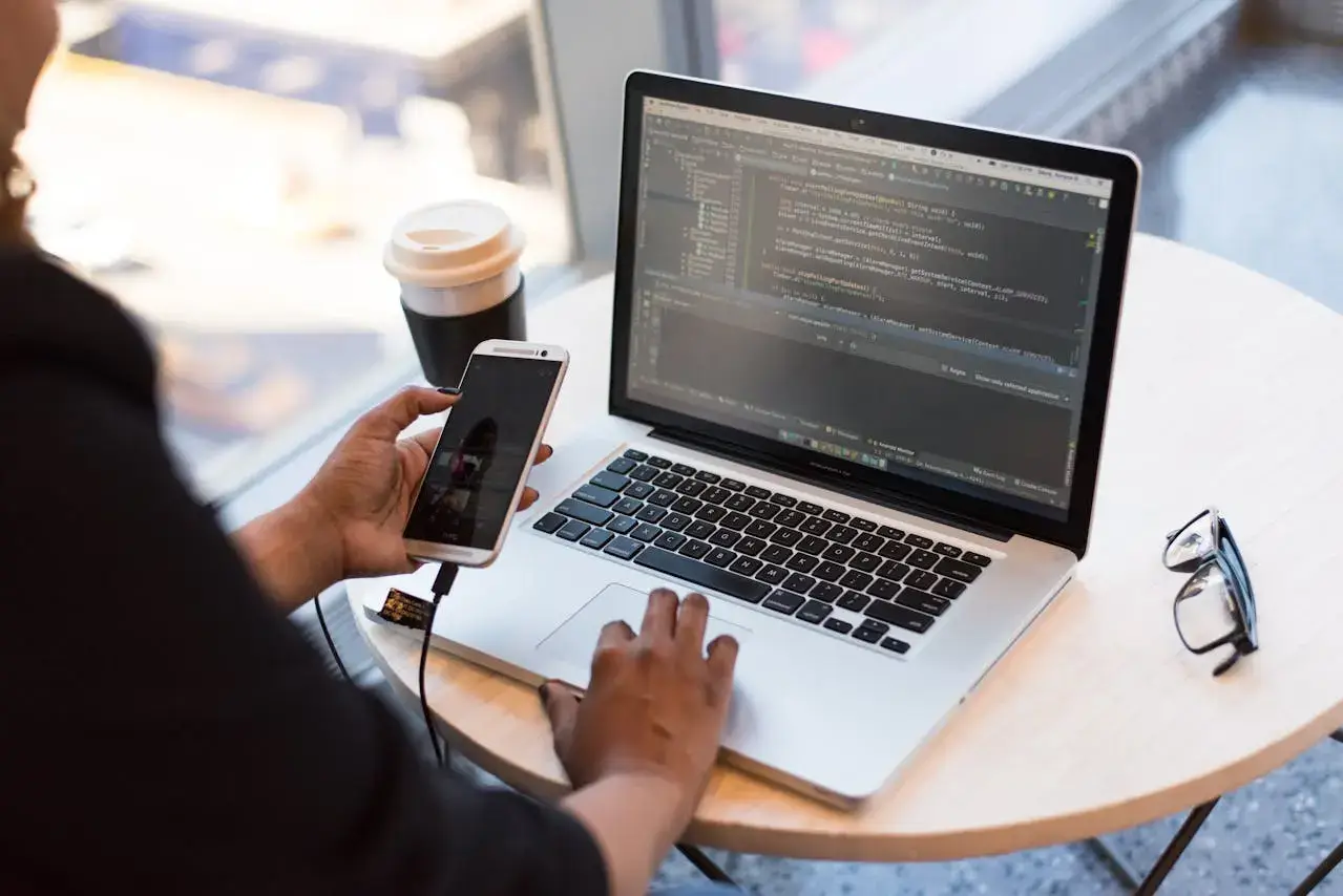 mobile phone connected to laptop